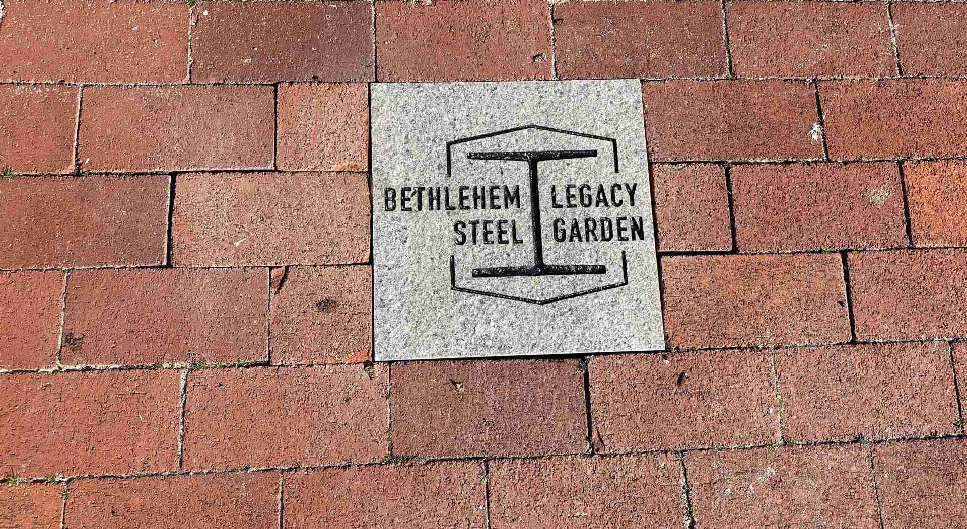 This photo shows a row of bricks and a commemorative plaque that reads, "Bethlehem Steel Legacy Garden"